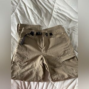 Men’s tan cargo pants that have a zipper to make them into shorts.